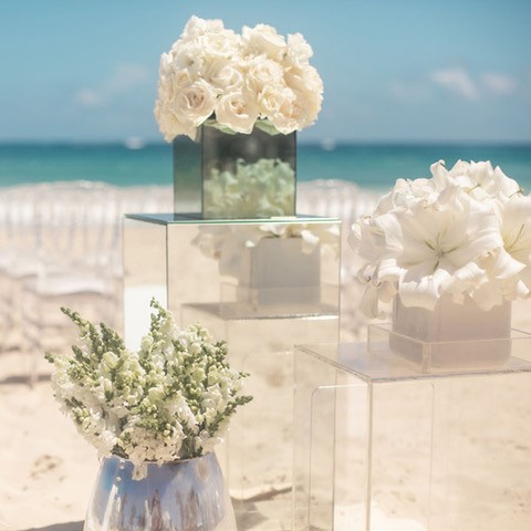 White florals at a beach ceremony