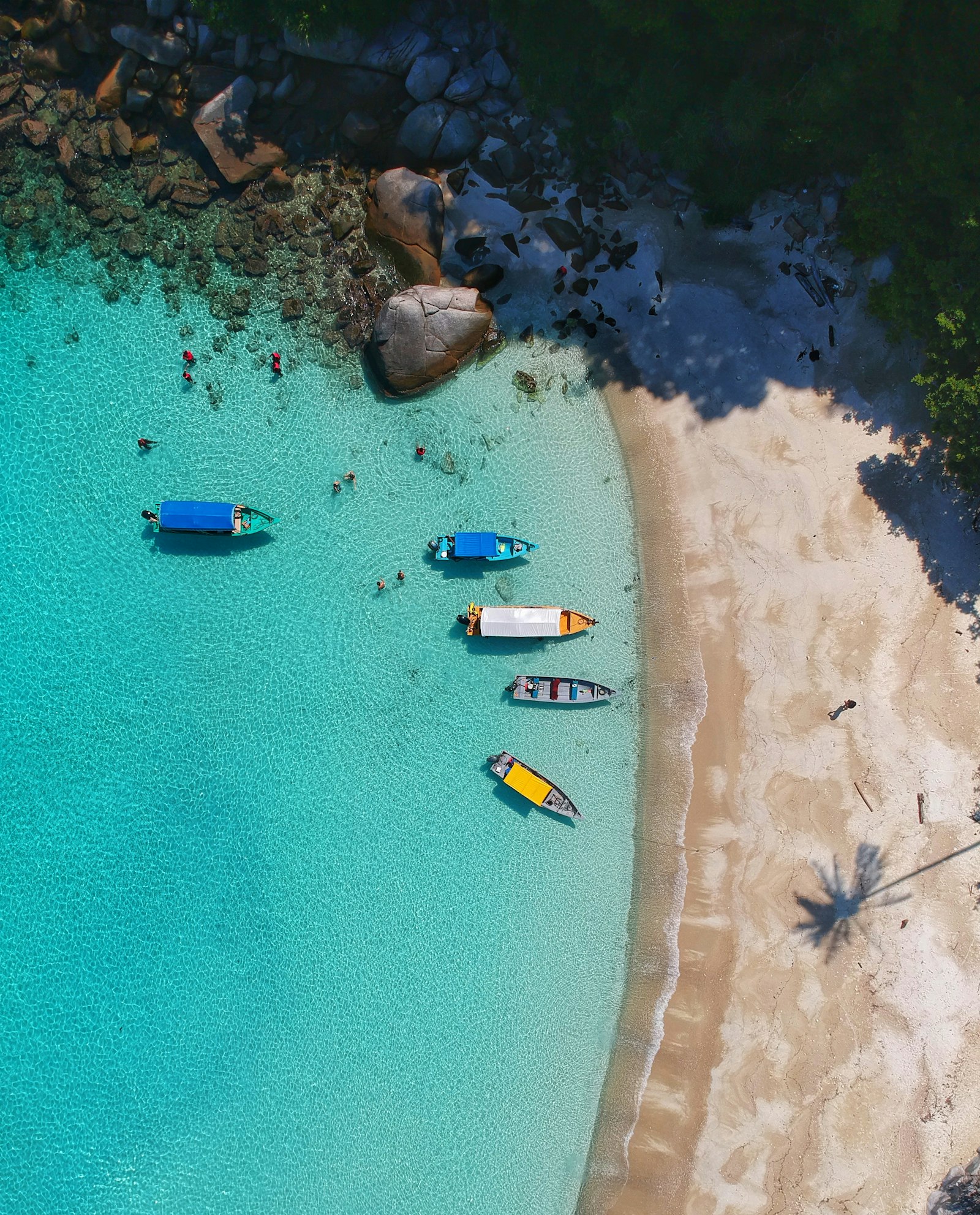 Boats gathered on turquoise shallows