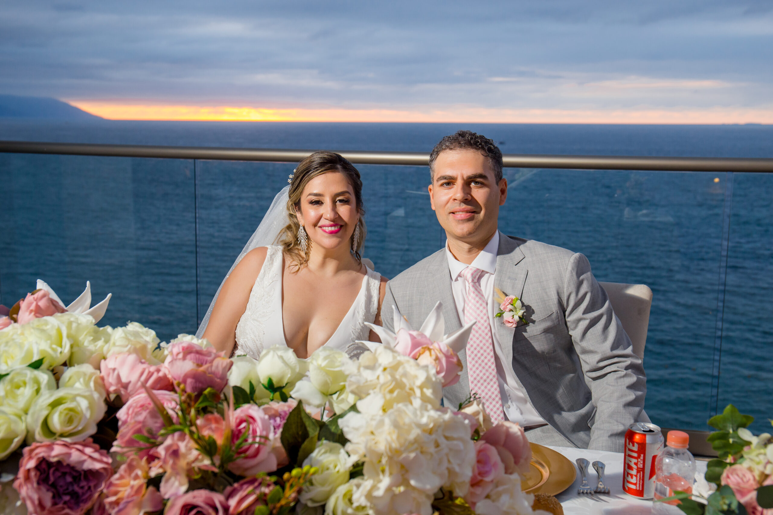 Newlyweds at their sunset sweetheart table