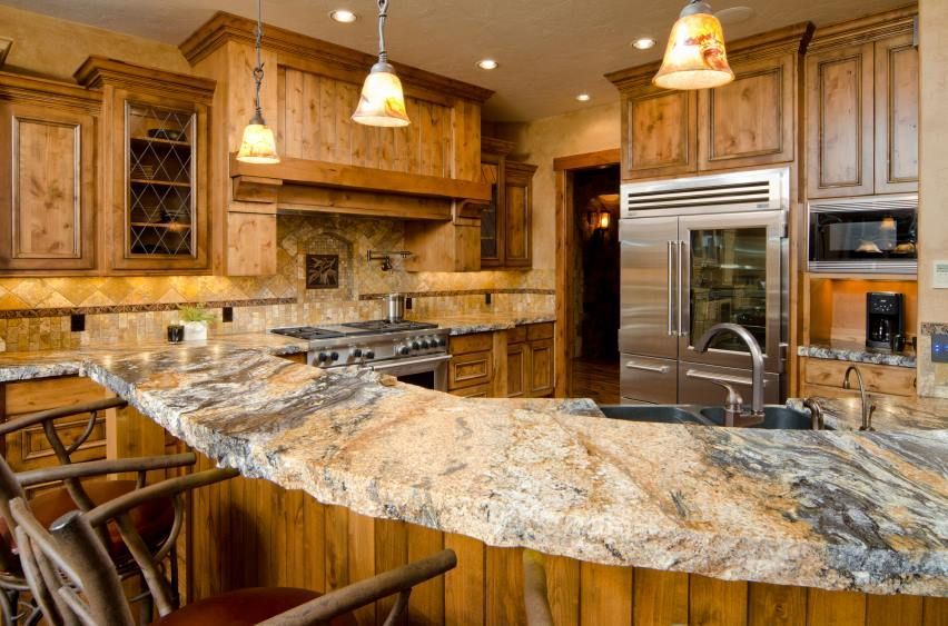 Granite countertop and warm wood kitchen